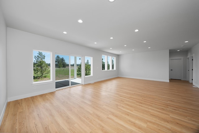 3621 W Montgomery Rd, Deer Park, WA 99006 - unfurnished living room with recessed lighting, baseboards, and light wood-type flooring
