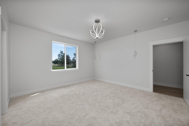 3621 W Montgomery Rd, Deer Park, WA 99006 - carpeted empty room with baseboards and a chandelier