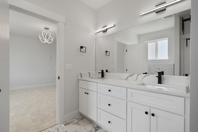 3621 W Montgomery Rd, Deer Park, WA 99006 - full bathroom with visible vents, double vanity, marble finish floor, baseboards, and a sink