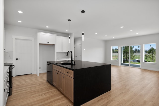 3621 W Montgomery Rd, Deer Park, WA 99006 - kitchen featuring dark countertops, a sink, light wood finished floors, and dishwasher
