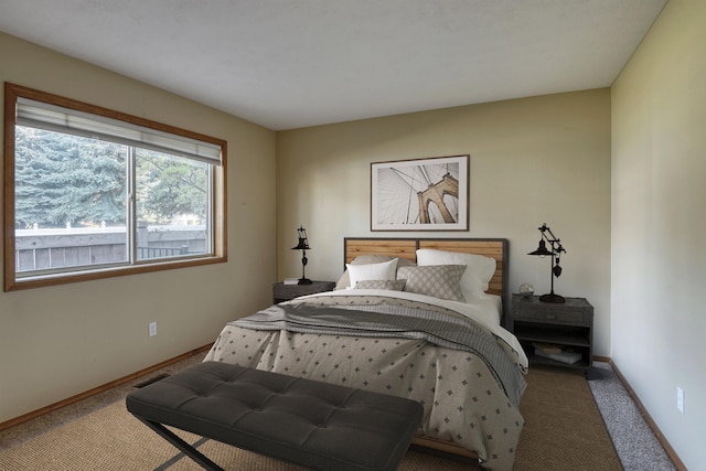 carpeted bedroom with baseboards