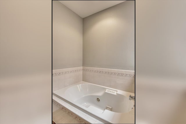 full bath featuring a tub with jets