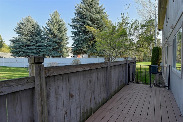 deck with fence and a lawn
