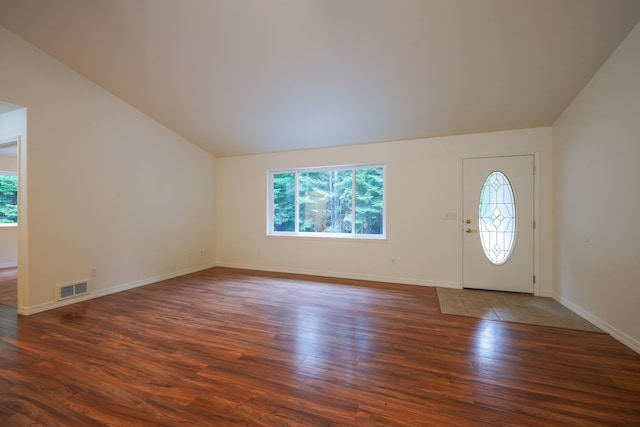 entrance foyer featuring visible vents, wood finished floors, and a wealth of natural light