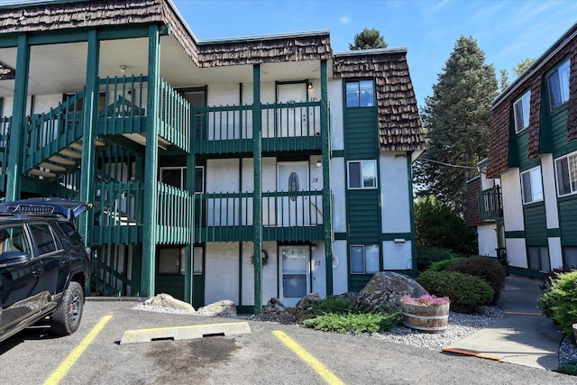 2121 E Upriver Dr # 19, Spokane, WA 99207 - view of building exterior featuring uncovered parking