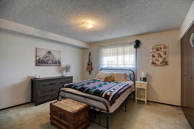 2121 E Upriver Dr # 19, Spokane, WA 99207 - bedroom featuring baseboards, a textured ceiling, and light colored carpet