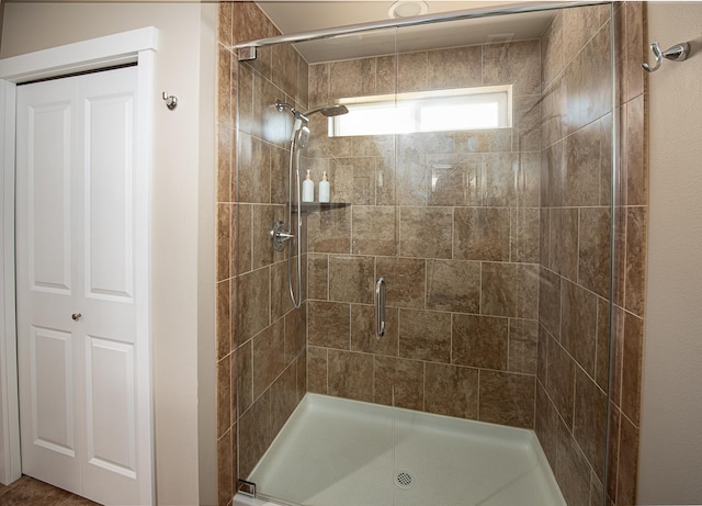 bathroom with a shower stall
