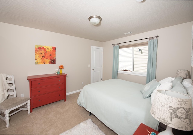 bedroom featuring carpet flooring, baseboards, and visible vents