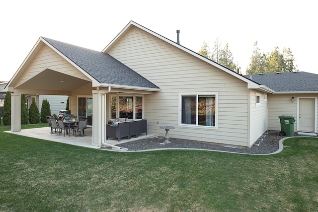 rear view of property with a yard, a shingled roof, an outdoor hangout area, and a patio area