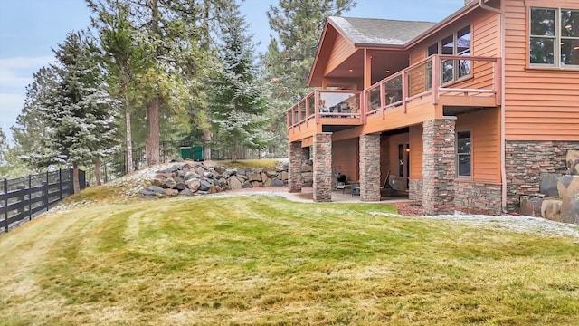 view of yard with a patio, fence, and a wooden deck