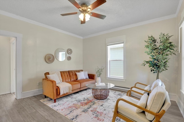 living area featuring crown molding, a textured ceiling, ceiling fan, and wood finished floors