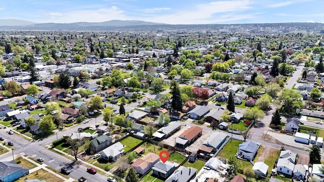 birds eye view of property with a mountain view