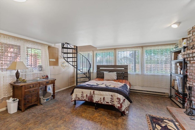 bedroom featuring baseboards and a baseboard heating unit