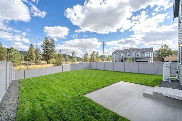 view of yard with a fenced backyard and a patio area