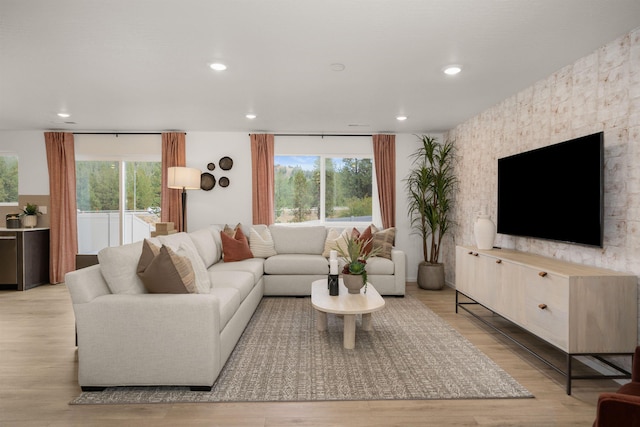 living room with recessed lighting and light wood-type flooring