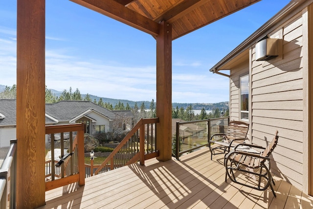 wooden terrace featuring a mountain view