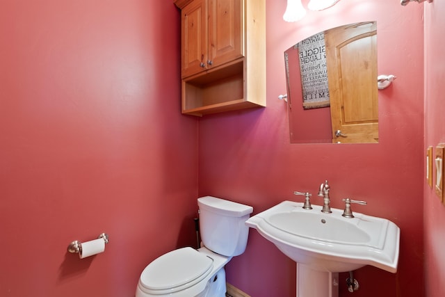 bathroom with a sink and toilet