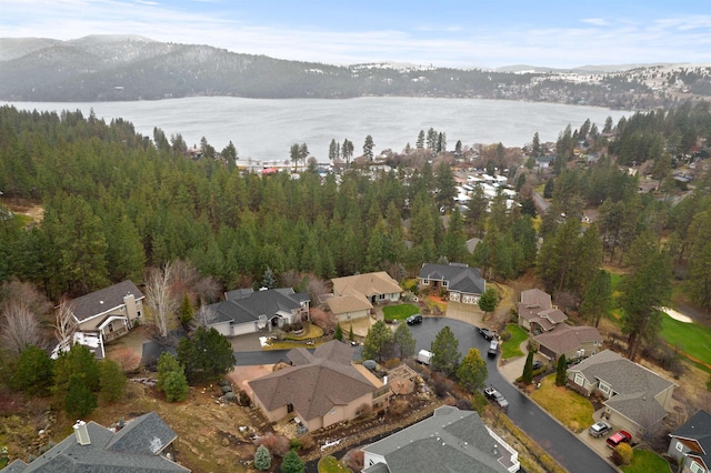 drone / aerial view with a water view and a residential view