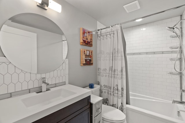 full bath featuring backsplash, visible vents, vanity, toilet, and shower / bath combo with shower curtain
