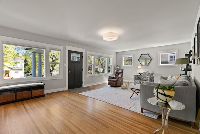 living room featuring light wood-style floors and baseboards