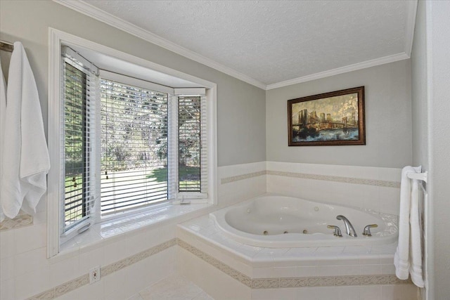 full bath featuring a textured ceiling, ornamental molding, and a jetted tub