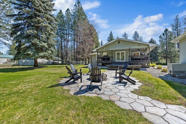 exterior space featuring a yard, ceiling fan, fence, and a patio area