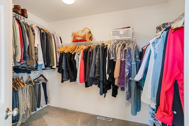 walk in closet featuring carpet floors and visible vents