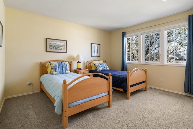 bedroom featuring baseboards and carpet floors