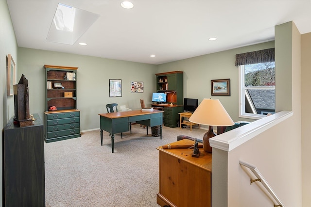 office area with recessed lighting, a skylight, light carpet, and baseboards