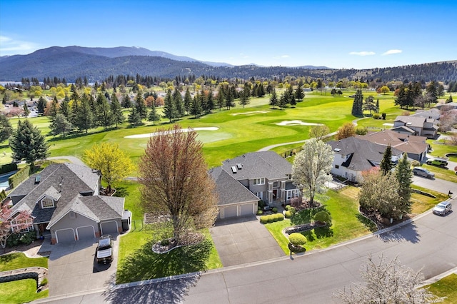 bird's eye view with a residential view, a mountain view, and golf course view