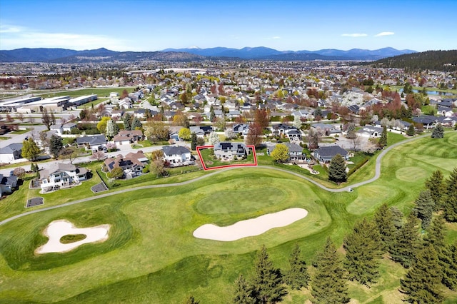 aerial view with a residential view, a mountain view, and golf course view