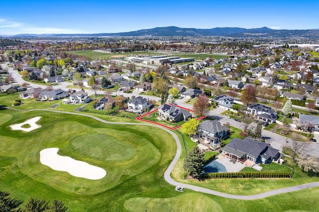 birds eye view of property featuring a residential view, a mountain view, and golf course view