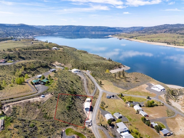 bird's eye view with a water and mountain view