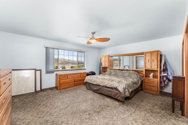 bedroom featuring carpet flooring, a ceiling fan, and baseboards