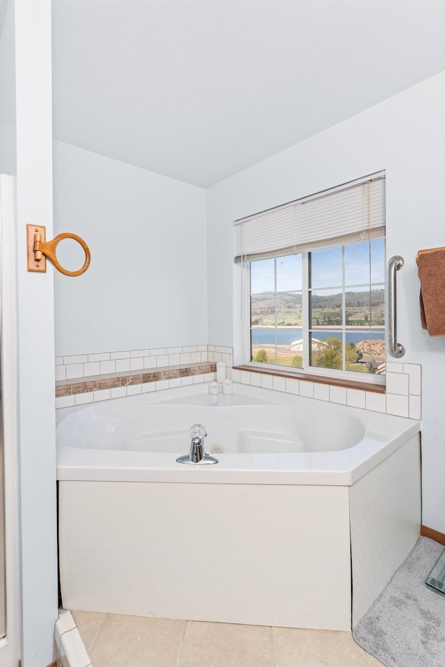 full bath with tile patterned flooring and a garden tub