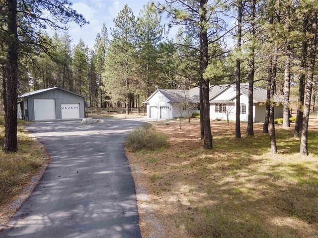 815 E Shelter Ln, Deer Park, WA 99006 - view of front of house with a garage and an outdoor structure
