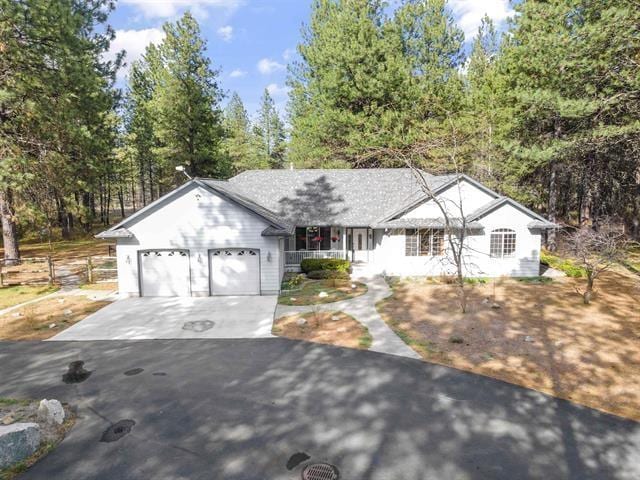 815 E Shelter Ln, Deer Park, WA 99006 - ranch-style house featuring driveway, an attached garage, and covered porch