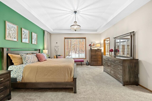 815 E Shelter Ln, Deer Park, WA 99006 - bedroom featuring light colored carpet, a raised ceiling, a chandelier, and baseboards