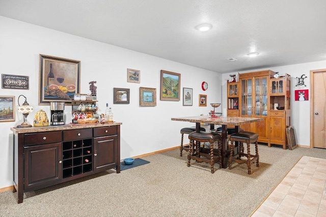 815 E Shelter Ln, Deer Park, WA 99006 - dining room featuring light colored carpet, baseboards, a bar, and recessed lighting