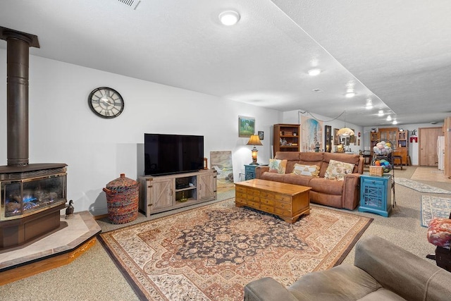 815 E Shelter Ln, Deer Park, WA 99006 - living room featuring a wood stove, baseboards, and recessed lighting