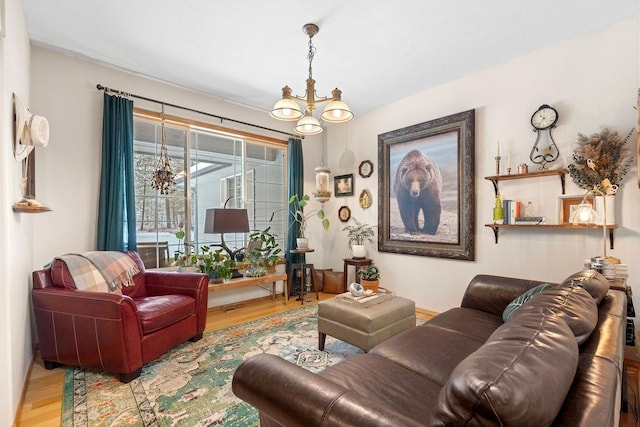 815 E Shelter Ln, Deer Park, WA 99006 - living room featuring wood finished floors and a chandelier