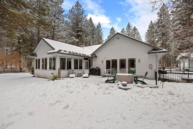 815 E Shelter Ln, Deer Park, WA 99006 - snow covered back of property featuring fence and a sunroom