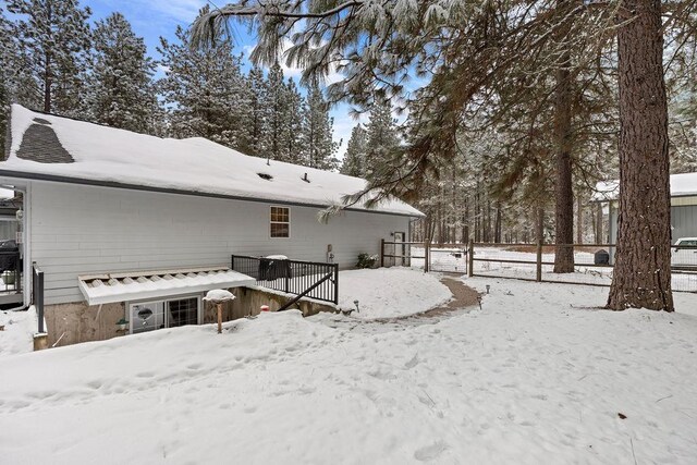 815 E Shelter Ln, Deer Park, WA 99006 - view of snowy exterior featuring fence and a deck