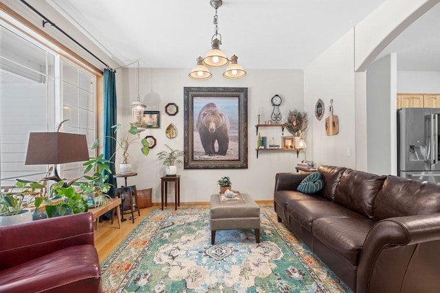 815 E Shelter Ln, Deer Park, WA 99006 - living room featuring arched walkways and light wood-style flooring