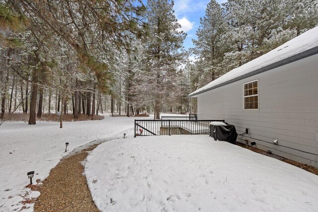 815 E Shelter Ln, Deer Park, WA 99006 - yard covered in snow with a wooden deck