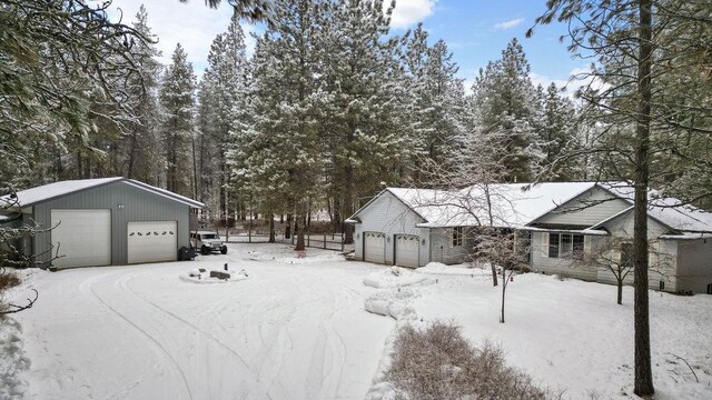 815 E Shelter Ln, Deer Park, WA 99006 - yard layered in snow featuring a garage