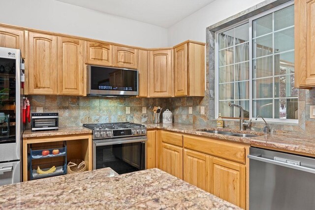 815 E Shelter Ln, Deer Park, WA 99006 - kitchen with appliances with stainless steel finishes, a sink, and tasteful backsplash