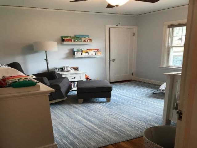 bedroom with baseboards, a ceiling fan, and wood finished floors