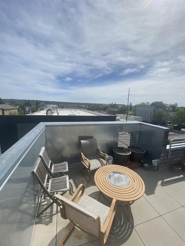 view of patio featuring a balcony