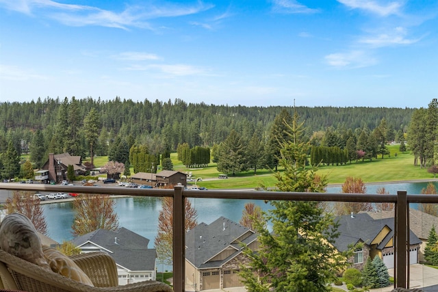 property view of water with a wooded view